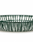 A shallow round ceramic bowl with a dark green and white vertical brushstroke pattern, shown against a plain white background.