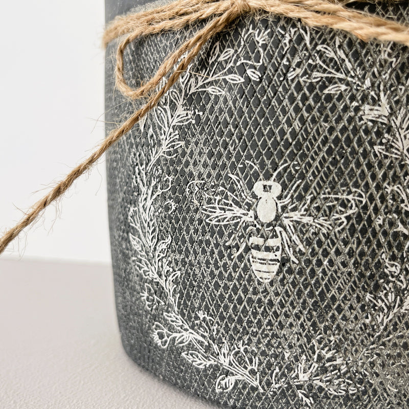 Ceramic textured Bee wreath indoor planter in charcoal black with jute string bow