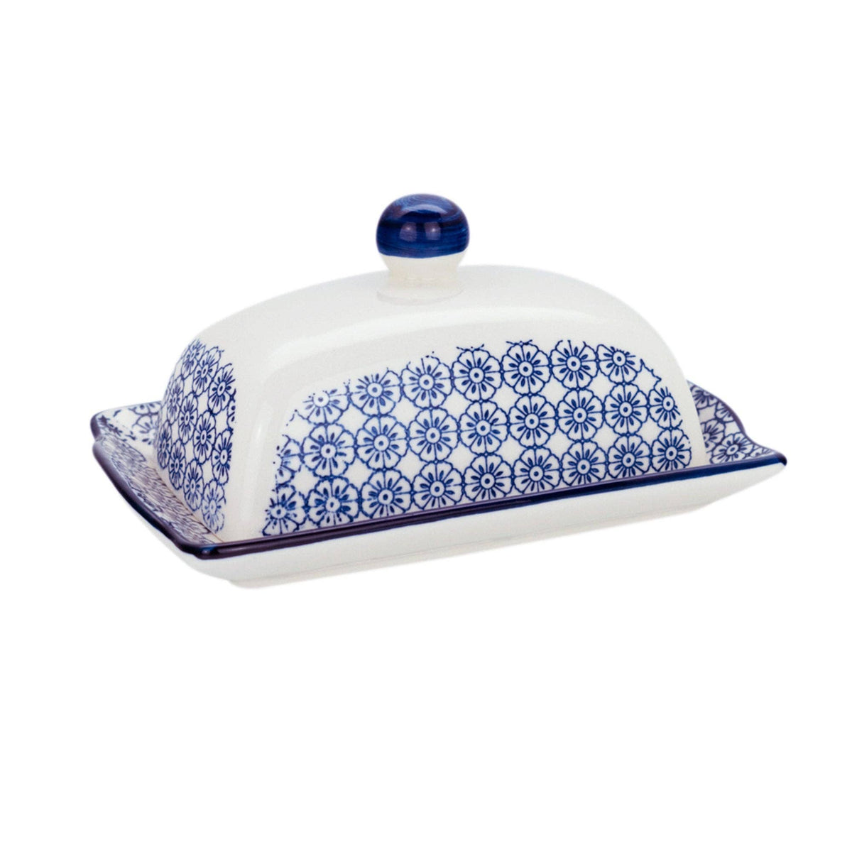 White ceramic butter dish with blue floral patterns on a white background