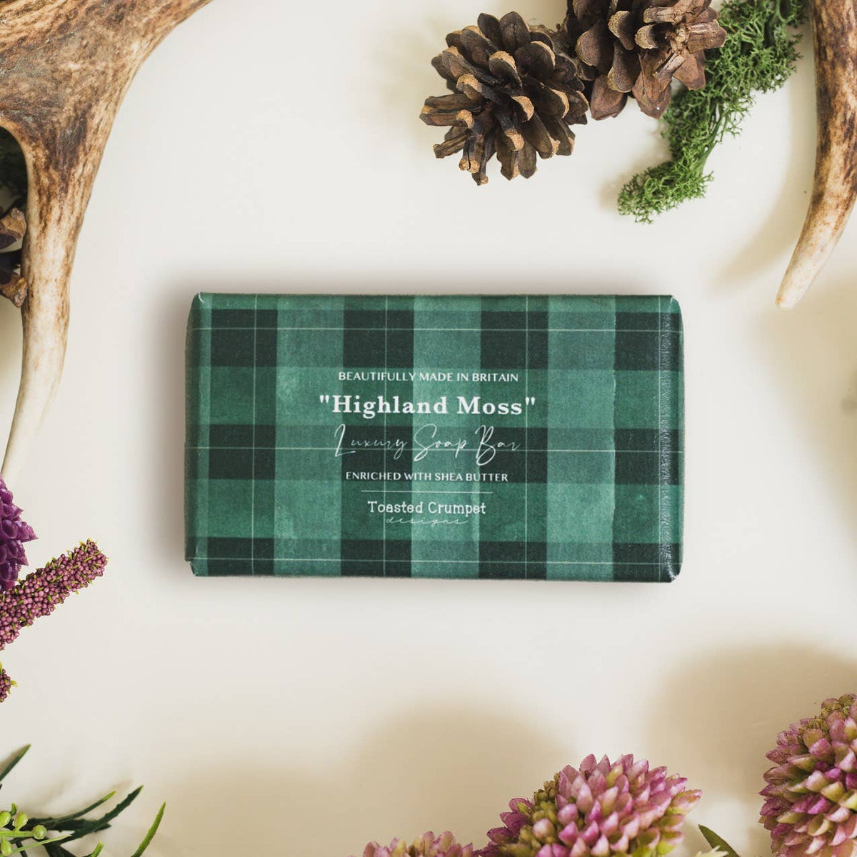 Highland Moss luxury soap bar in green and black plaid packaging