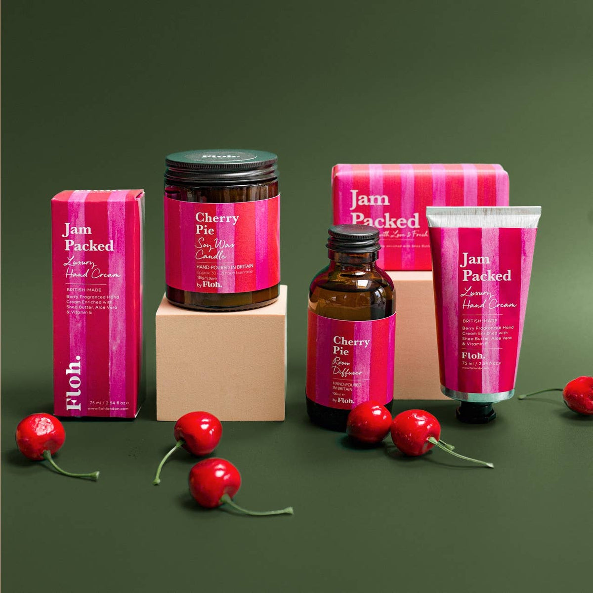 Jam Packed 190g luxury soap bar shown with matching berry fragrance hand cream, Cherry Pie candle and reed diffuser