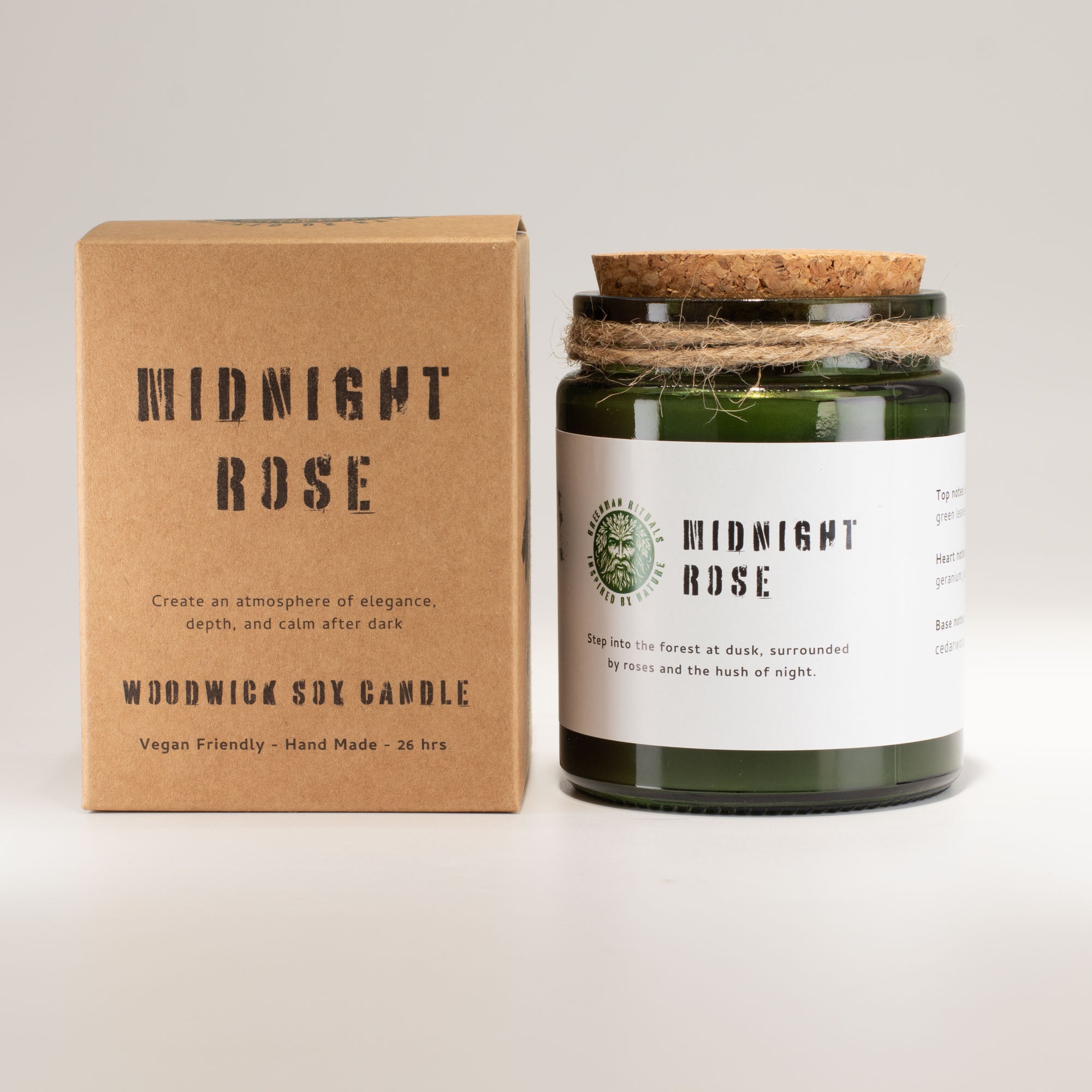 Woodwick soy candle labeled 'Midnight Rose' with its packaging on a light gray background