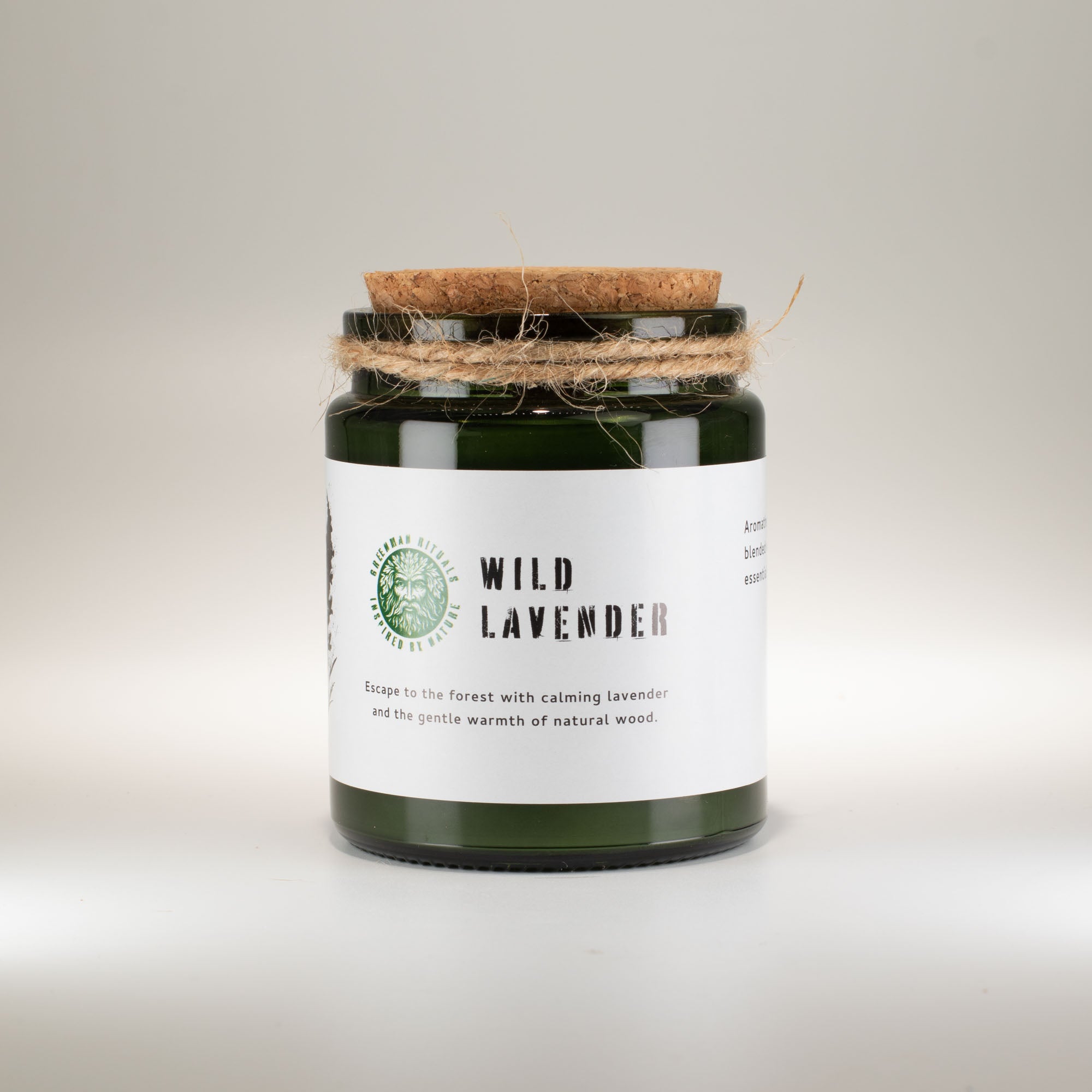 Candle jar labeled 'Wild Lavender' with a cork lid on a light background