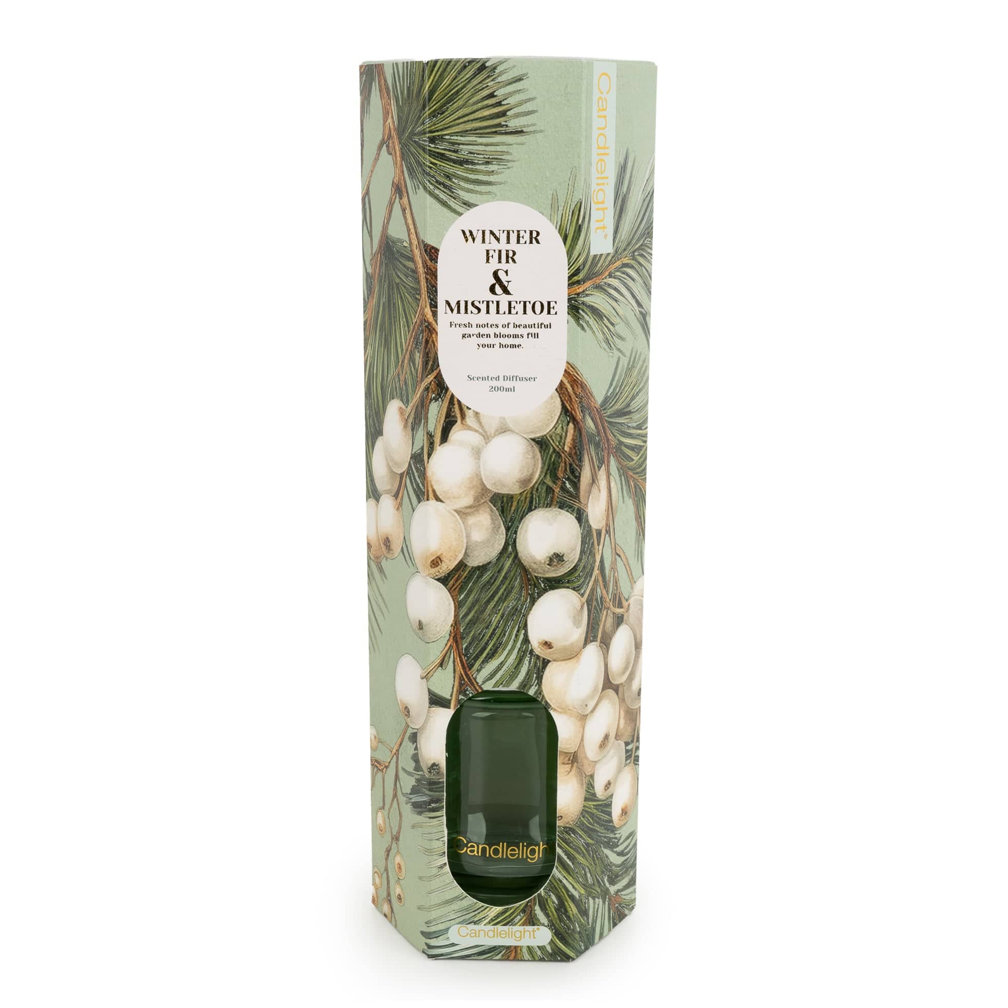 A tall, narrow Candlelight gift box for 'Winter Fir & Mistletoe' scented diffuser oil, featuring a botanical illustration of pine branches, white berries, and a dark green cylindrical diffuser bottle visible through a cutout near the bottom.