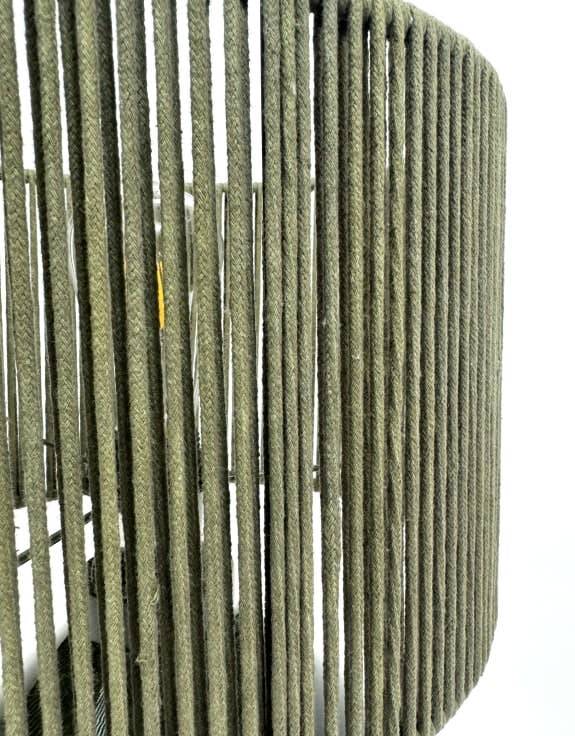Close-up of a green woven basket with a white background