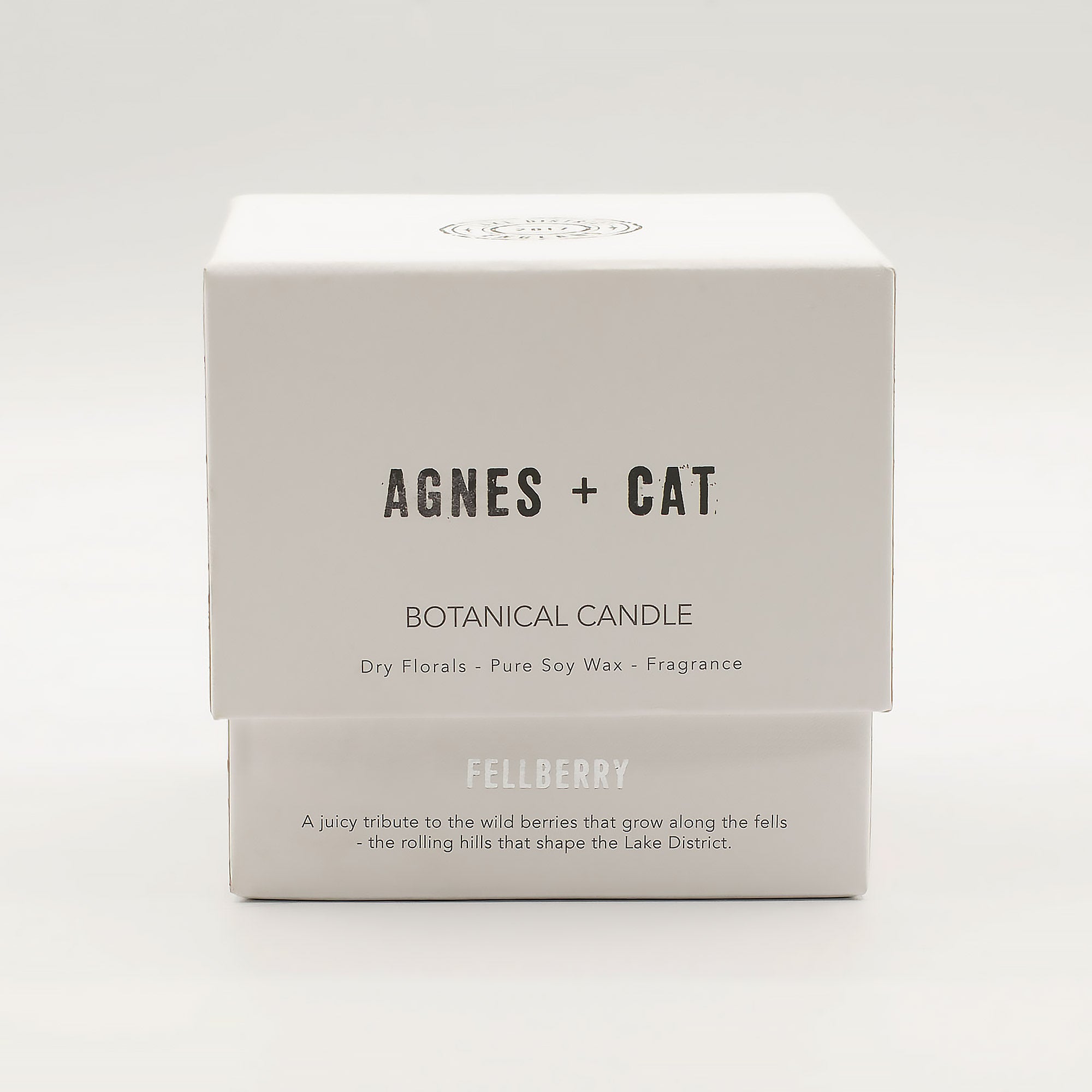 Box of Agnes + Cat botanical candle on a white background