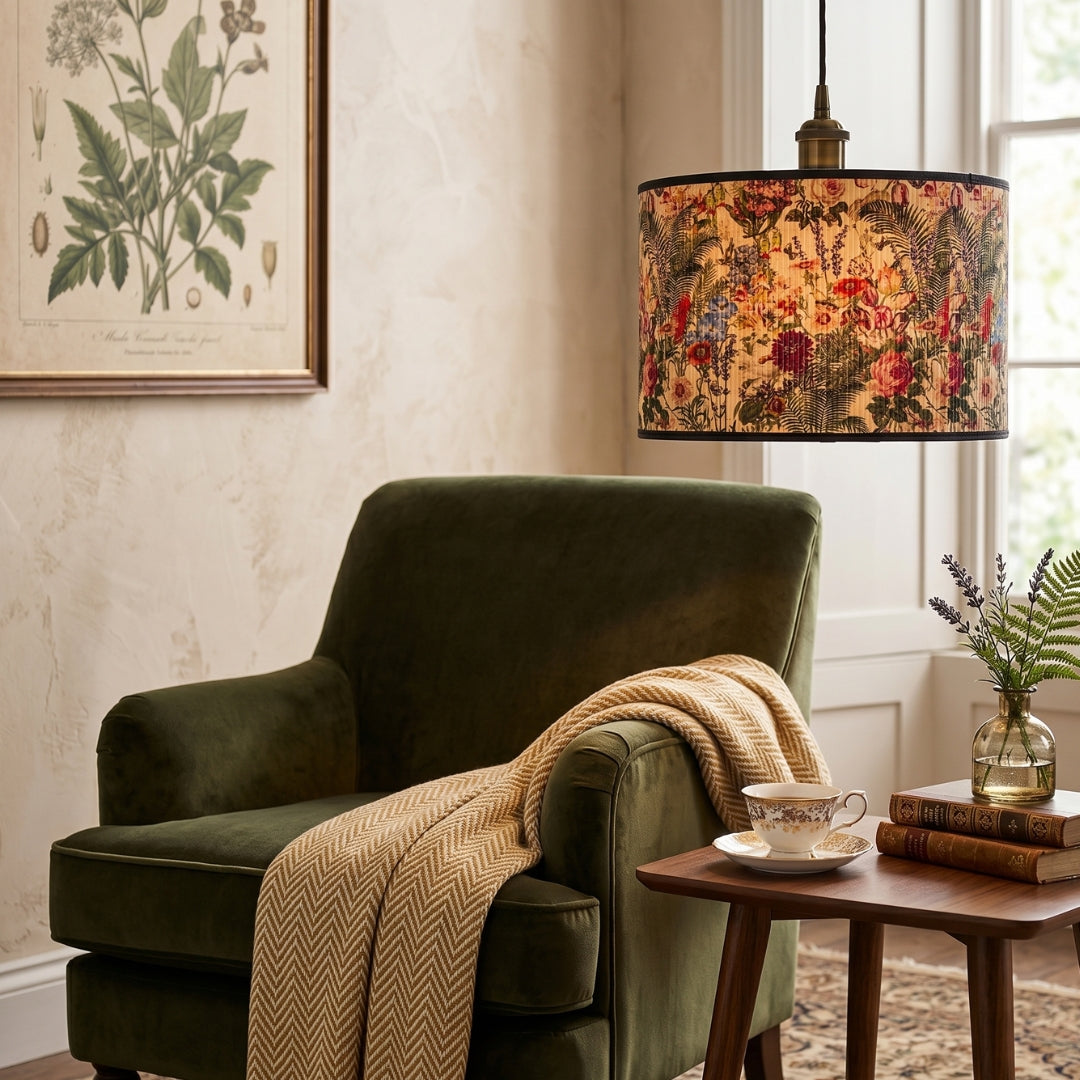 Cozy living room with a green armchair, floral lampshade, and books.