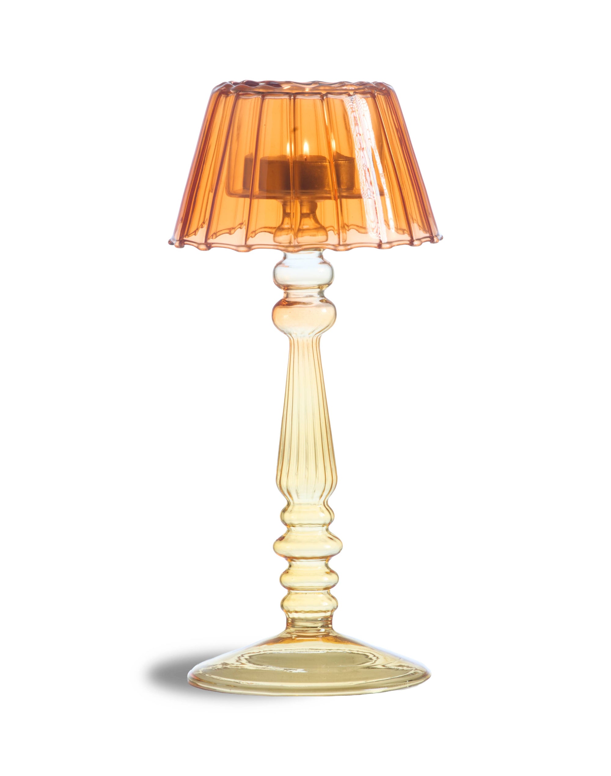 An amber glass table lamp with a fluted pleated shade and a matching ribbed stem and base, shown on a white background with a soft shadow.