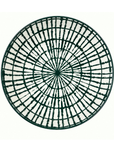 A round white plate with a dark green radial grid pattern, photographed from directly above on a white background.