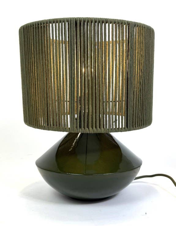 Table lamp with woven shade on a white background