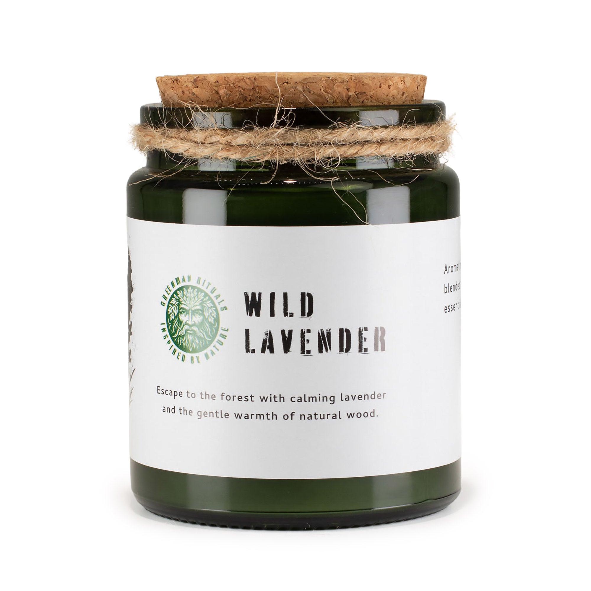 Candle in a green jar with a cork lid and white label on a white background