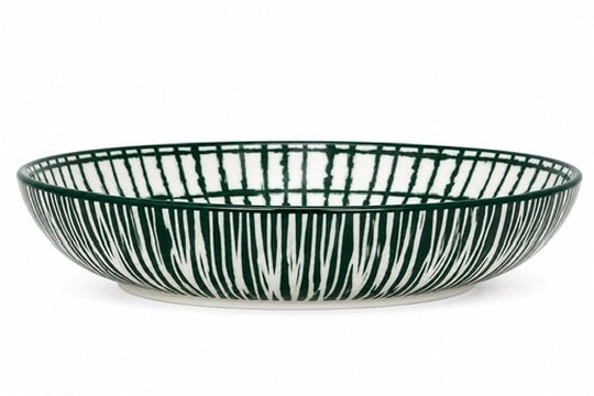 A shallow round ceramic bowl with a dark green and white vertical brushstroke pattern, shown against a plain white background.