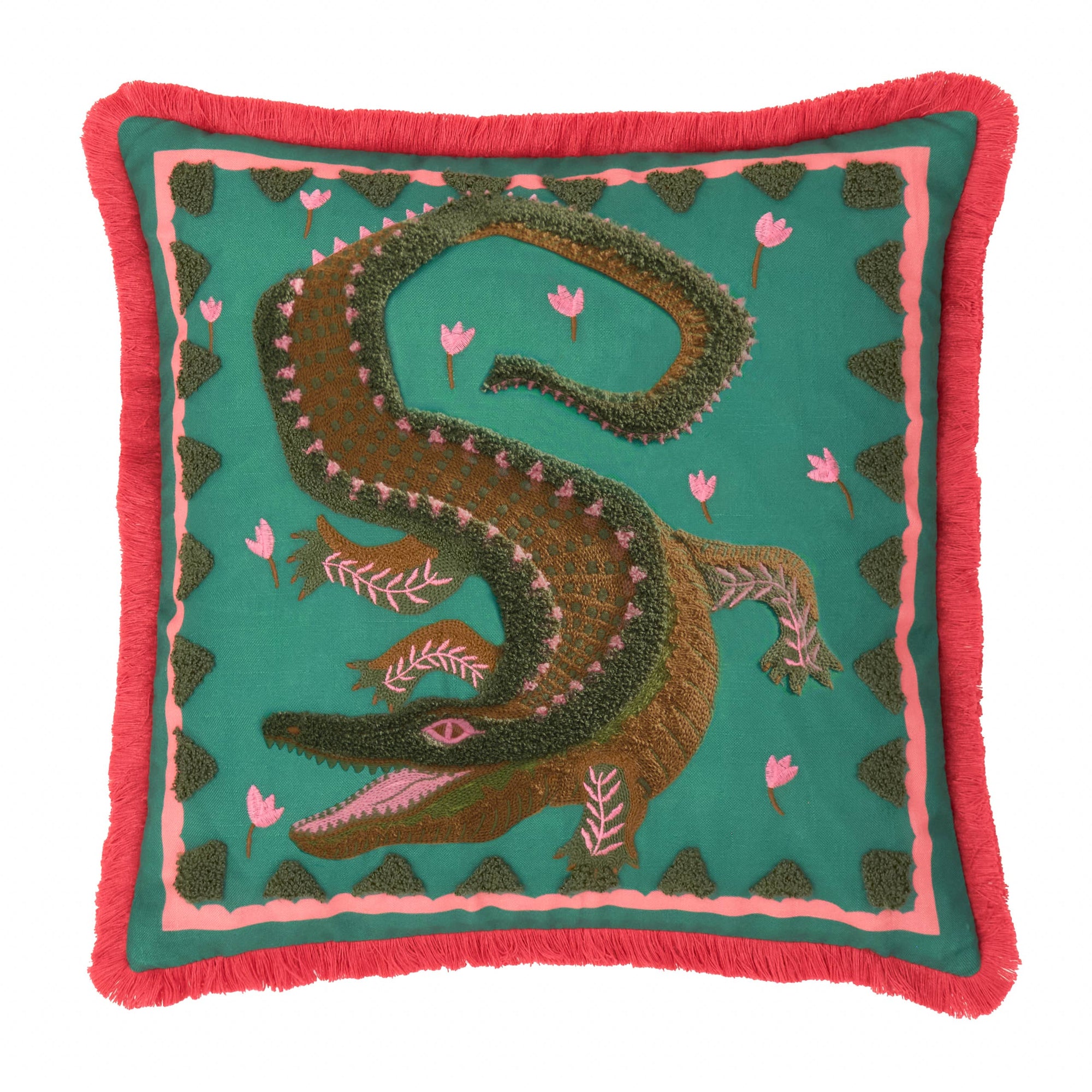 Decorative pillow with alligator design on a teal background