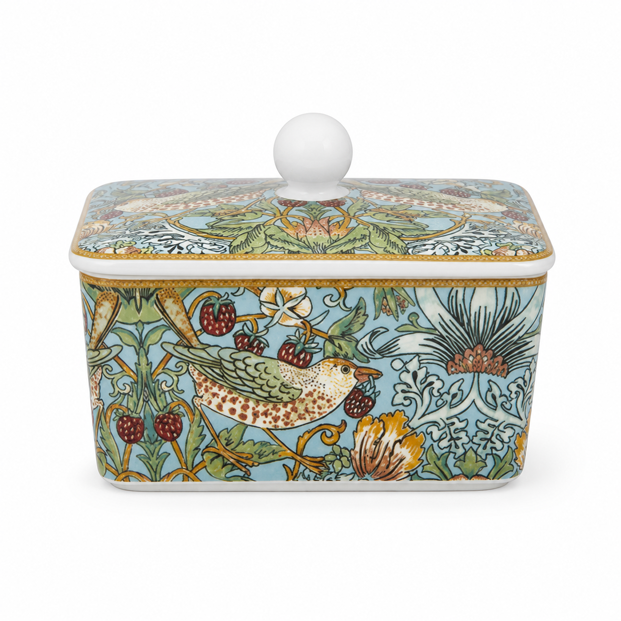 A rectangular ceramic butter dish with a lid, featuring a William Morris-style botanical and bird pattern in light blue, green, gold, and brown on a white background.